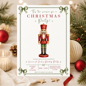 May include: A white Christmas party invitation card featuring a central watercolor nutcracker in red, green, and gold. The text reads: 'Tis The season for a CHRISTMAS PARTY! PLEASE JOIN US TO CELEBRATE Lauren's & Jack's Holiday Party SATURDAY 19TH DECEMBER 6PM - LATE 123 FESTIVE LANE CHRISTMAS TOWN FL 12345 RSVP TO LAUREN | 512-345-678. The card is framed by a thin green border with four green bows at the corners.