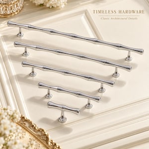 May include: Five polished chrome cabinet pulls in varying lengths, each featuring a segmented bamboo-inspired design with two mounting posts. The text TIMELESS HARDWARE Classic Architectural Details is visible in the upper right corner.