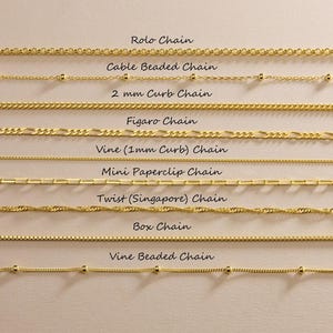 May include: A collection of eight gold-toned metal chains arranged horizontally, labeled as Rolo Chain, Cable Beaded Chain, 2 mm Curb Chain, Figaro Chain, Vine (1mm Curb) Chain, Mini Paperclip Chain, Twist (Singapore) Chain, Box Chain, and Vine Beaded Chain.