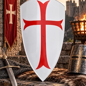 May include: A white heater shield featuring a large, centered red cross with flared ends. The shield is positioned alongside a metal sword with a black grip and a dark, weathered metal helmet with a cross-shaped faceplate reinforcement.