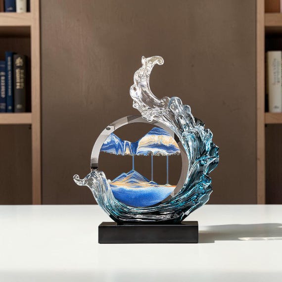 Flowing sand sealed in resin creates a living, ever-shifting seascape on your desk — genuinely meditative and visually unlike anything mass-produced.