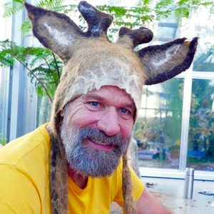 Hand felted deer hat with little stubby antlers and large ears in a blend of natural brown and white wool and alpaca. worn by Dutch Wim Hof the Ice Man for his cold water therapy and retreats in the snow.