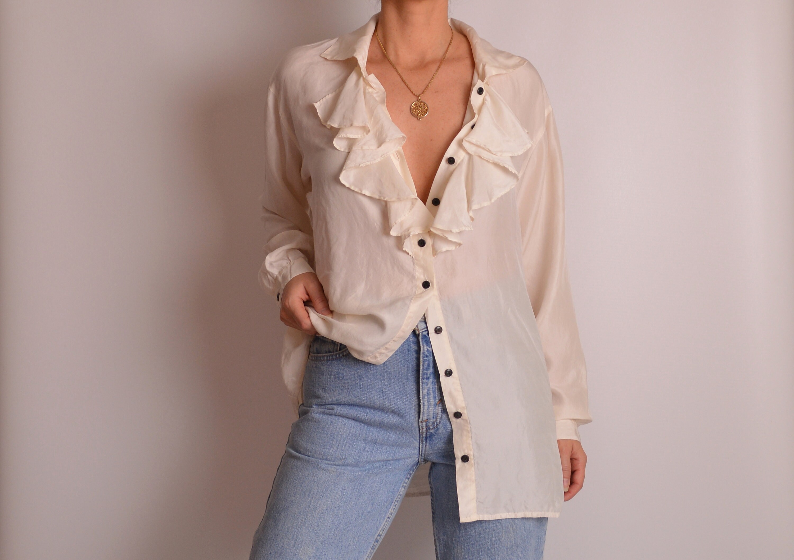 cream ruffle blouse