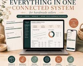 A laptop and a smartphone display a business command center and order tracker amid craft supplies.