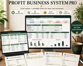 A laptop and a monitor display a lawn care business spreadsheet with sections for monthly dashboard, route profit, job quotes, and route information, surrounded by a plant and a coffee mug.