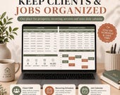 A laptop shows a client CRM and job calendar schedule spreadsheet, accompanied by a mug labeled clean and grow, a pen holder, and a plant.
