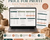 A laptop showing a pricing dashboard sits with wholesale pricing worksheets, gift boxes, and a pen.