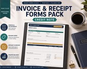 A desktop setup with a monitor displaying a credit note form, surrounded by printed forms, a calculator, and a notebook.