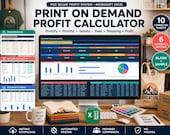 A desktop setup with a monitor displaying a spreadsheet, surrounded by folded t-shirts, a tote bag, a mug, and a color palette.