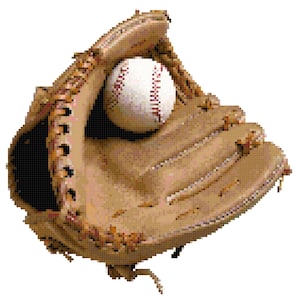 May include: A brown leather baseball mitt with a white baseball inside. The mitt is open and the ball is resting in the pocket.