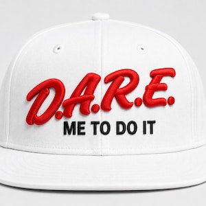 May include: A white baseball cap featuring the red embroidered text D.A.R.E. in a raised, puffy font. Below the red text, the phrase ME TO DO IT is embroidered in black, flat lettering. The cap has a structured crown and a flat brim.