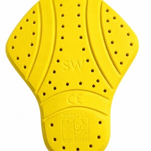 May include: A bright yellow protective armor insert with a contoured shape and multiple ventilation holes. The surface features embossed text including SW, CE, EN1621-1, and WINTEXPERT, along with a graphic icon indicating motorcycle safety certification.