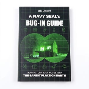 May include: A black book titled A Navy Seal's Bug-In Guide by Joel Lambert. The cover features a green night-vision binocular overlay showing a house, with grid lines and icons for supplies like batteries, a flashlight, and a first aid kit.