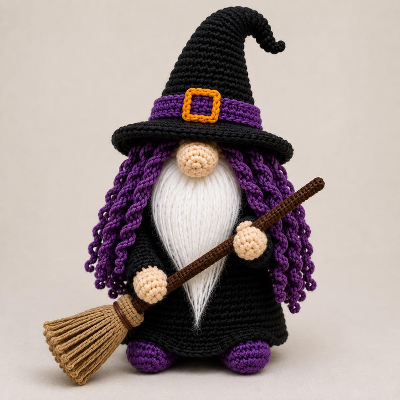 May include: A crocheted gnome figure wearing a black pointed hat with a purple band and an orange buckle. The gnome has long purple curly hair, a white beard, and a black outfit. It holds a brown broomstick and has purple feet.