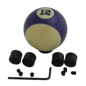 May include: A purple and cream billiard ball gear shift knob featuring the number 12 in a black font. The set includes four black cylindrical adapters, four small black set screws, and one black L-shaped hex key for installation purposes.
