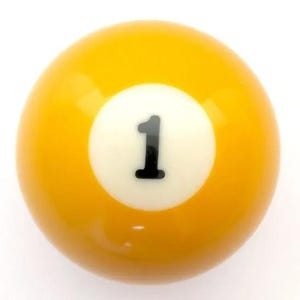 May include: A smooth, spherical yellow billiard ball featuring a centered white circular field. The number one is printed in a bold, black sans-serif font within the white circle. The surface of the ball is glossy and reflects light evenly.