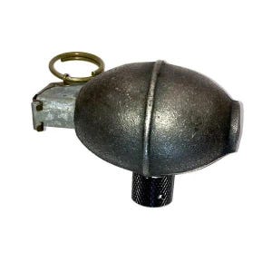 May include: A dark gray, oval-shaped metal object with a textured surface, featuring a silver-colored mechanical lever assembly on one side, a gold-toned circular pull ring at the top, and a small, black, cylindrical knurled base at the bottom.