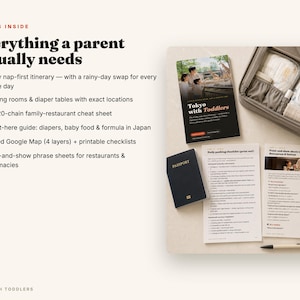 May include: A travel guide titled Tokyo with Toddlers, a dark blue passport, two printed checklists, and a grey organizer bag filled with baby supplies. The text on the guide reads Tokyo with Toddlers, and the checklists include headers like Daily packing checklist and Point-and-show sheets.