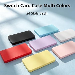 Könnte beinhalten: Eine Sammlung rechteckiger Switch-Kartenetuis in Schwarz, Rot, Gelb, Hellblau, Lavendel, Rosa und Weiß. Jedes Etui bietet 24 Steckplätze zur Aufbewahrung. Der Text "Switch Card Case Multi Colors" und "24 Slots Each" ist zu sehen.
