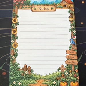 May include: A rectangular notepad with horizontal lines and a pixel art farm theme. The border features sunflowers, a wooden fence, a blue bird with a heart, and signs labeled Notes, Farm, Friends, and Good Days against a mountain backdrop.