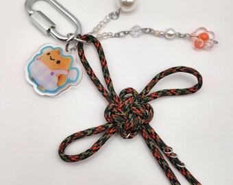 Acrylic Charm Keychain with Beads and a Pierced Camo Paracord Lucky Knot