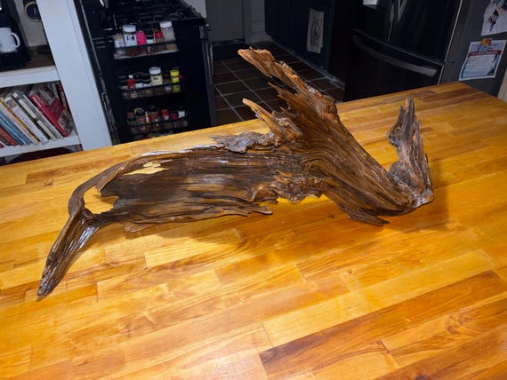 A genuinely one-of-a-kind rustic driftwood/wood sculpture — no two are alike, and at $170 it signals real craft time investment.