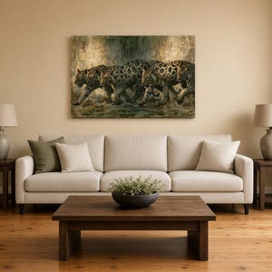 May include: A rectangular wall art print featuring a group of large cats with dark spots and stripes walking together in a misty, muted landscape. The artwork displays a blend of earthy tones, including shades of brown, grey, and muted green.