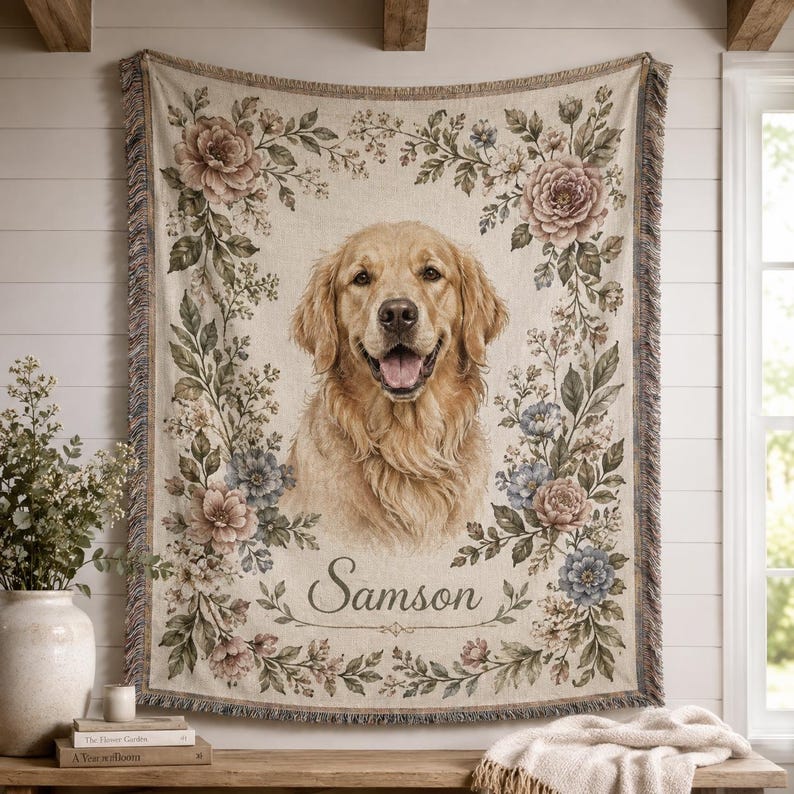Personalized woven pet portrait blanket with golden retriever named Samson, vintage floral border, and fringe edge displayed as wall decor.