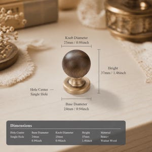 May include: A round cabinet knob with a dark brown wooden top and a brass base. Dimensions are labeled as 0.98 inches knob diameter, 0.94 inches base diameter, and 1.46 inches height. The hardware features a single hole center design.
