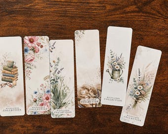 May include: Six rectangular bookmarks featuring watercolor illustrations of wildflowers, books, and gardening tools. Each bookmark displays a unique floral or literary motif in soft pastel tones and includes the text "WILDFLOWER COLLECTION" at the bottom.