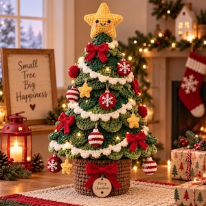 May include: A crocheted green Christmas tree in a brown basket base, topped with a smiling yellow star. It is decorated with white garland, red bows, and red and white ornaments. A wooden tag on the basket reads Merry Christmas with a heart.