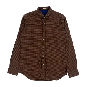 May include: A long-sleeve button-down shirt featuring a small brown and black checkered pattern. The shirt has a structured collar, a front placket with seven visible buttons, and a dark blue inner collar lining. The cuffs are long and buttoned.