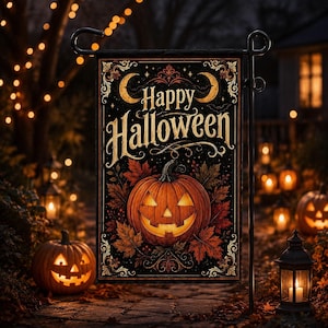 May include: A rectangular garden flag featuring a black background with gold text that reads Happy Halloween. The design includes a central carved jack-o'-lantern surrounded by autumn leaves, decorative filigree borders, and two crescent moons.