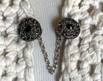 The mattie antiqued silver tone and black stone sweater clip