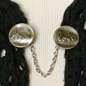 The mattie antiqued silver tone metal LOVE sweater clip