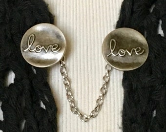 The mattie antiqued silver tone metal LOVE sweater clip
