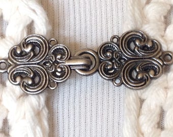 The mattie silver tone metal Celtic swirl sweater clip clasp
