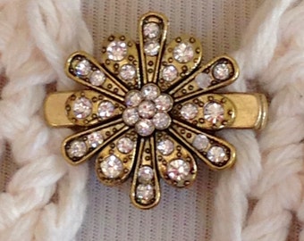 The mattie antiqued gold tone and rhinestone flower sweater clip brooch