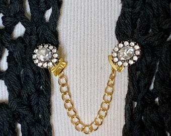 The mattie petite clear stone and rhinestone oval metal based sweater clip