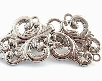 The mattie bright silver tone metal large swirl clasp sweater clip