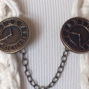 The mattie brass colored plastic clock face sweater clip