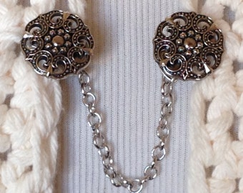 The mattie silver tone resin medallion sweater clip