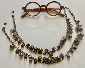 The mattie antiqued brass tone lilac glass and brass bead eyeglass chain