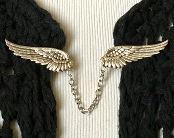 The mattie silver tone metal wings sweater clip