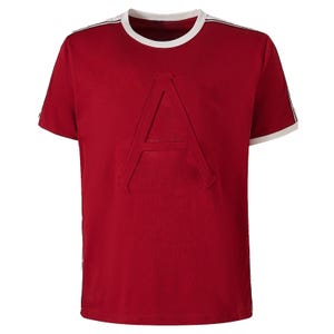 May include: A short-sleeved crew neck t-shirt in a deep red color. The front features a large, embossed capital letter A in the center. The garment has a white ribbed collar and white trim detailing along the shoulders and down the sides.