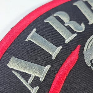 Anpassad lapp på baksidan av jackan bild 16