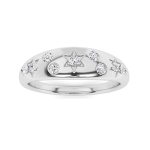 May include: A polished silver-toned ring featuring a domed band decorated with a celestial motif. The design includes several round clear stones set in circular bezels and star-shaped engravings, each centered with a small sparkling clear stone.