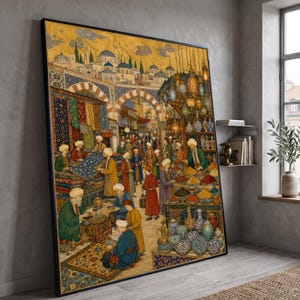 May include: A large framed wall art print depicting a bustling Middle Eastern marketplace scene with numerous figures in traditional attire, colorful textile stalls, hanging lanterns, and ceramic pottery under a golden architectural backdrop.