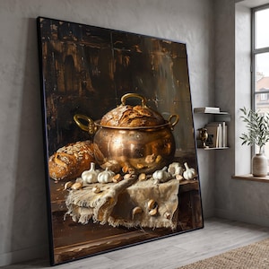 May include: A framed oil painting depicting a large copper pot with a lid containing a loaf of bread, positioned next to a second loaf of bread and several whole garlic bulbs on a textured cloth, set against a dark, moody background.