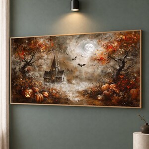 May include: A rectangular wall art print featuring a dark, atmospheric landscape with a haunted house, glowing jack-o'-lanterns, bare trees with autumn leaves, flying bats, and a full moon in a misty, cloudy sky with orange and brown tones.